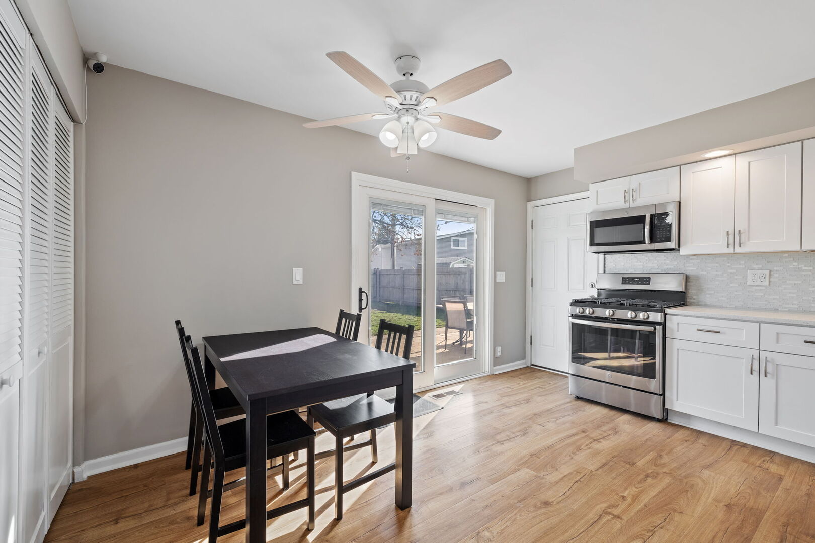235 Murphy Drive Romeoville, IL 60446 - Photo 5 of 16 a kitchen with a table chairs stove and cabinets