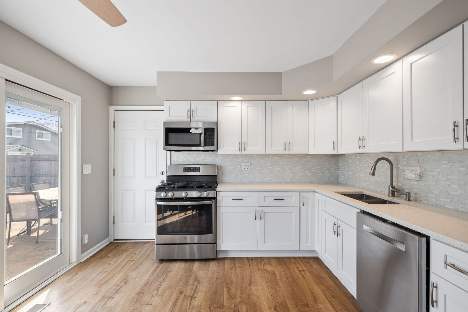 235 Murphy Drive Romeoville, IL 60446 - Photo 6 of 16 a kitchen with granite countertop a sink and steel appliances