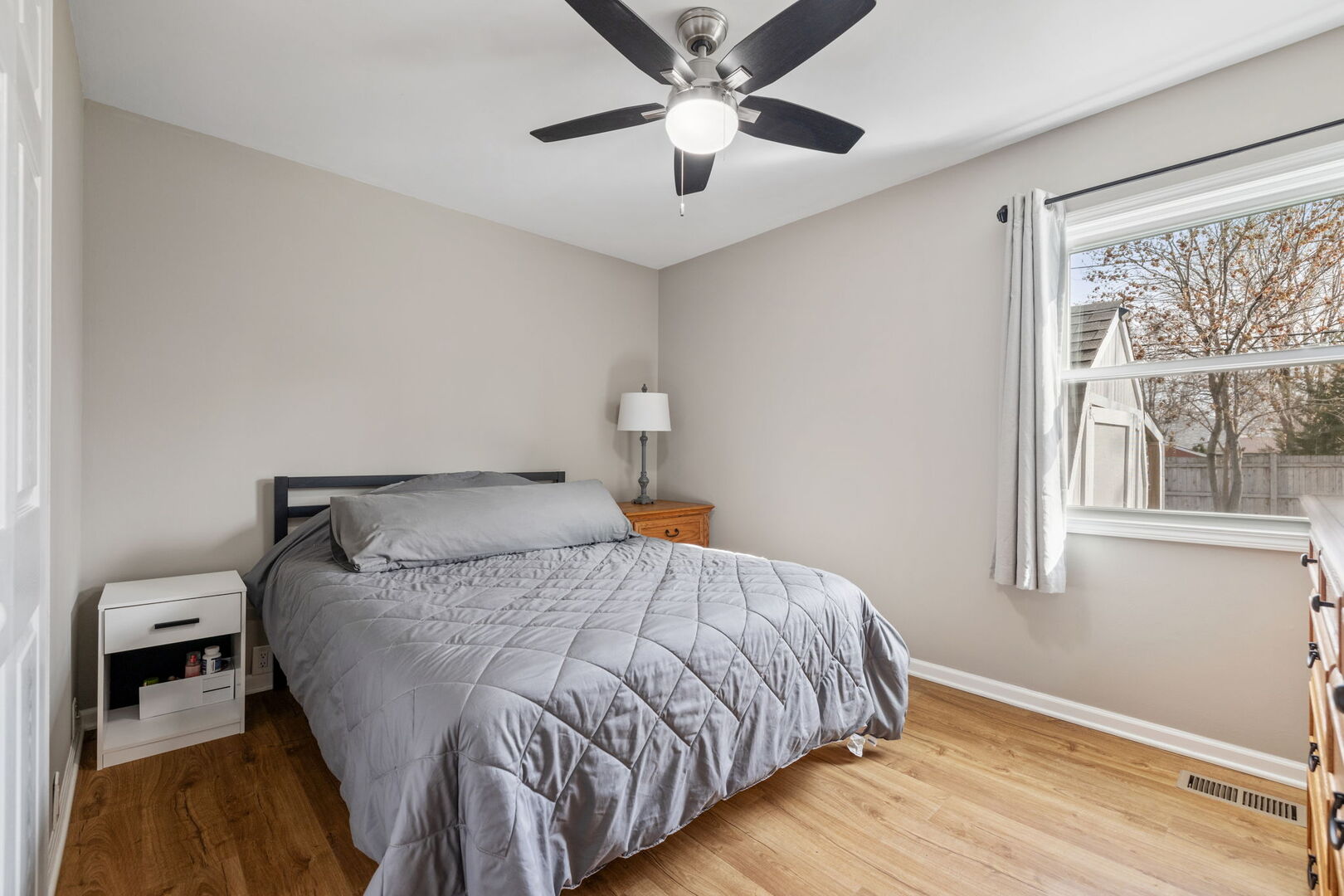 235 Murphy Drive Romeoville, IL 60446 - Photo 10 of 16 a bedroom with a bed and a window
