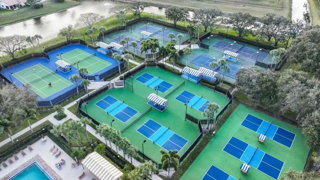 an aerial view of residential building and lake