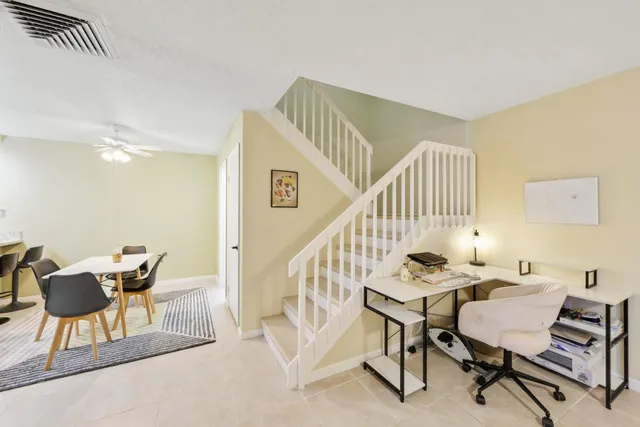 a view of a livingroom with furniture and lounge chair