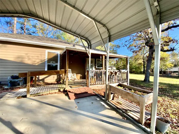 a view of a patio with table and chairs
