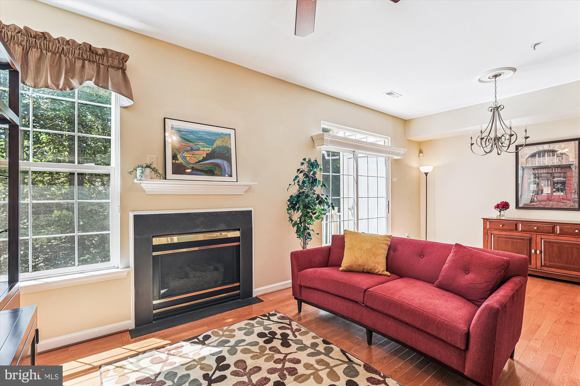 1307 Windleaf Drive, Unit 139N Reston, VA 20194 - Photo 12 of 38 a living room with furniture a window and a fireplace
