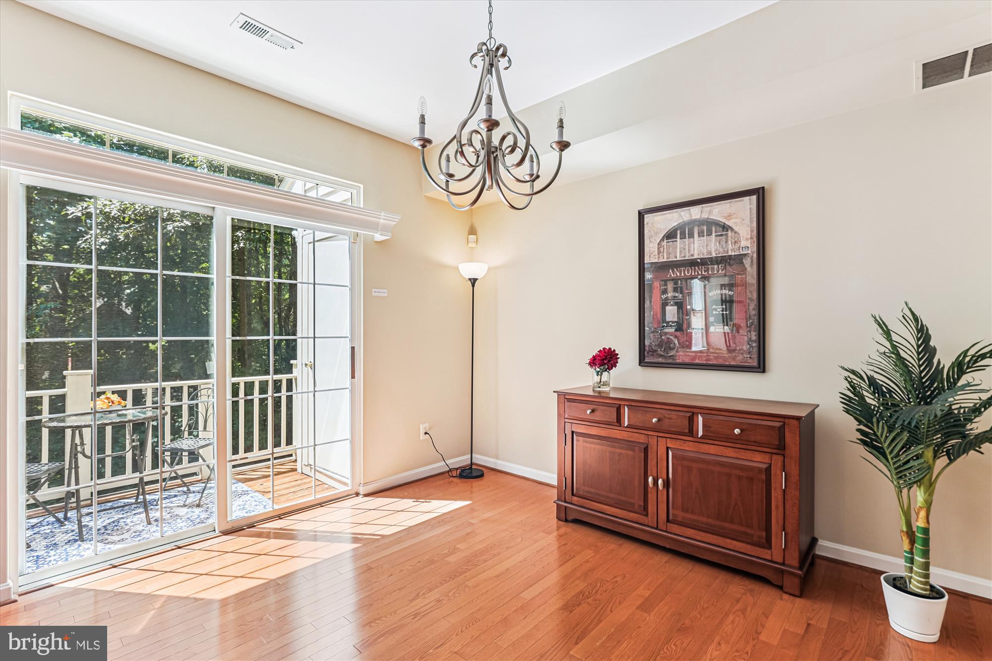 1307 Windleaf Drive, Unit 139N Reston, VA 20194 - Photo 13 of 38 a view of a room with wooden floor and windows