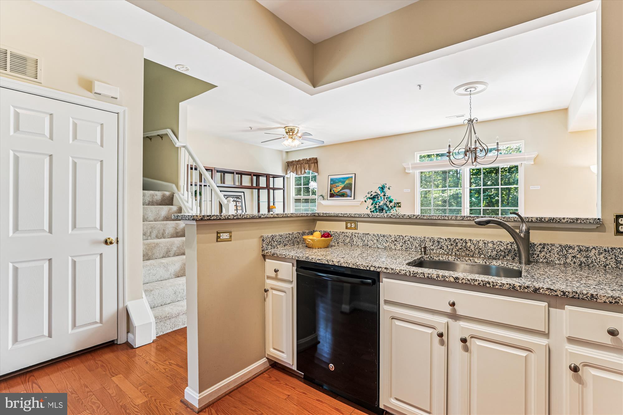 1307 Windleaf Drive, Unit 139N Reston, VA 20194 - Photo 14 of 38 a kitchen with granite countertop a sink and a stove