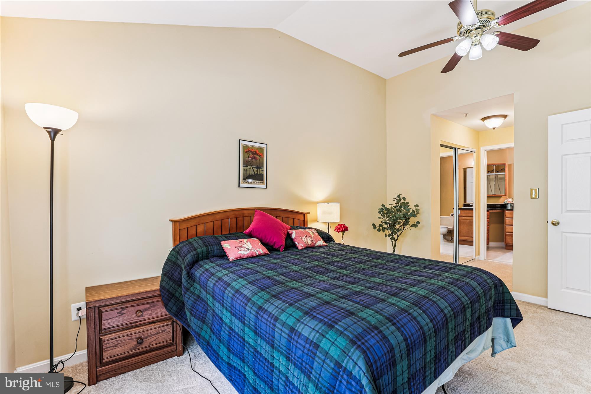 1307 Windleaf Drive, Unit 139N Reston, VA 20194 - Photo 26 of 38 a bedroom with a bed and a chandelier