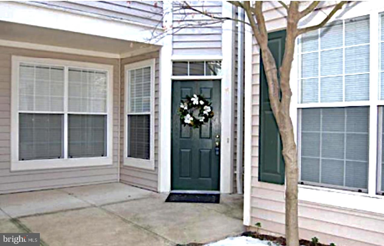 1307 Windleaf Drive, Unit 139N Reston, VA 20194 - Photo 3 of 38 a view of entrance gate of a building