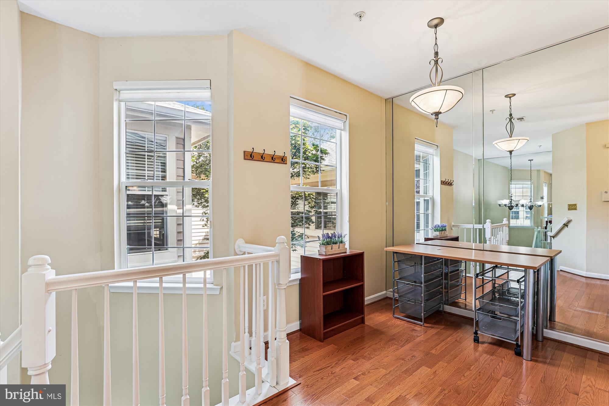 1307 Windleaf Drive, Unit 139N Reston, VA 20194 - Photo 6 of 38 a view of a room with wooden floor and windows