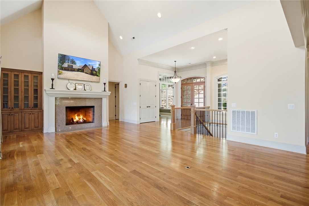 130 River Ridge Road Sunset, SC 29685 - Photo 8 of 47 This living space features a cozy fireplace, polished hardwood floors, and abundant natural light.