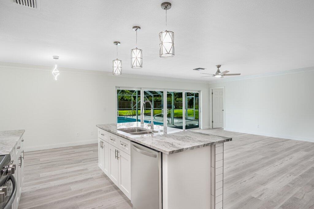 1899 Southeast Adair Road Port St. Lucie, FL 34952 - Photo 11 of 36 Kitchen to Primary.jpeg-SMALL