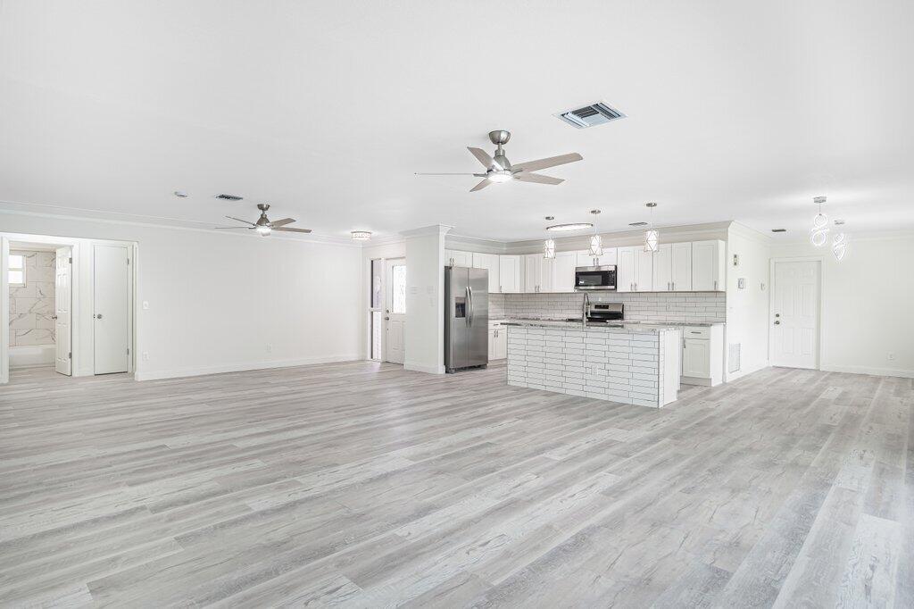 1899 Southeast Adair Road Port St. Lucie, FL 34952 - Photo 12 of 36 Living to Kitchen.jpeg-SMALL