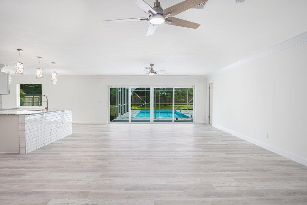 1899 Southeast Adair Road Port St. Lucie, FL 34952 - Photo 14 of 36 Living to Patio.jpeg-SMALL