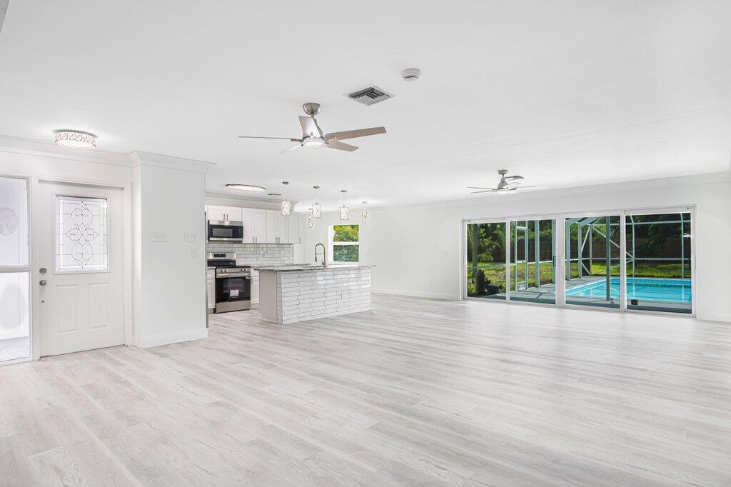 1899 Southeast Adair Road Port St. Lucie, FL 34952 - Photo 16 of 36 Living to Dining.jpeg-SMALL