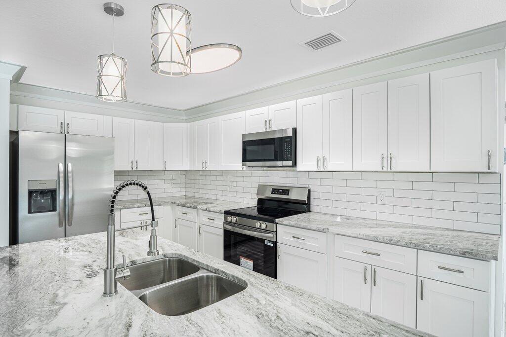 1899 Southeast Adair Road Port St. Lucie, FL 34952 - Photo 7 of 36 Kitchen L.jpeg-SMALL