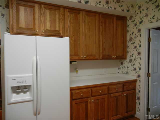 1017 Downing Way Court Raleigh, NC 27614 - Photo 10 of 25 Kitchen leads to formal dining room. Tons of storage space. Plus there is a walk in pantry!