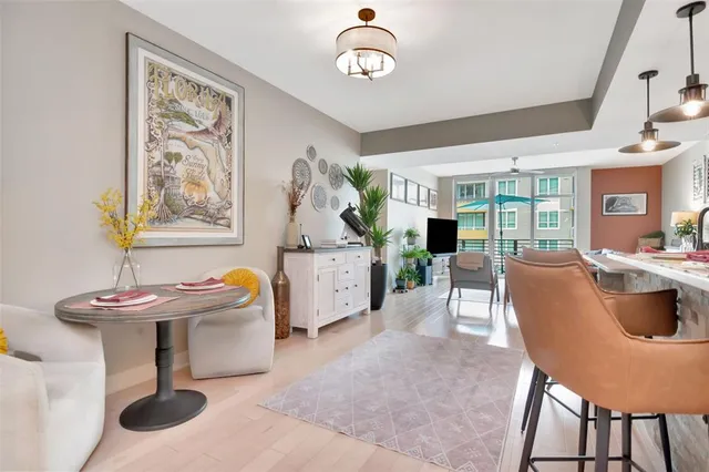 a dining room with furniture and window