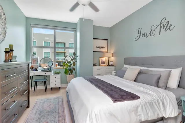 a bedroom with a bed and a table in it