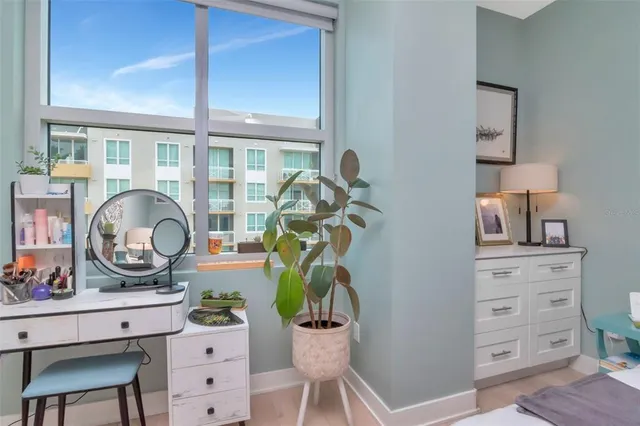 a bedroom with a bed and a television