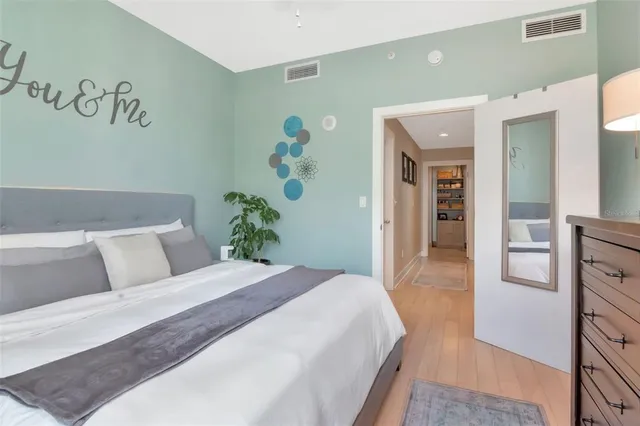 a view of walk in closet with clothes