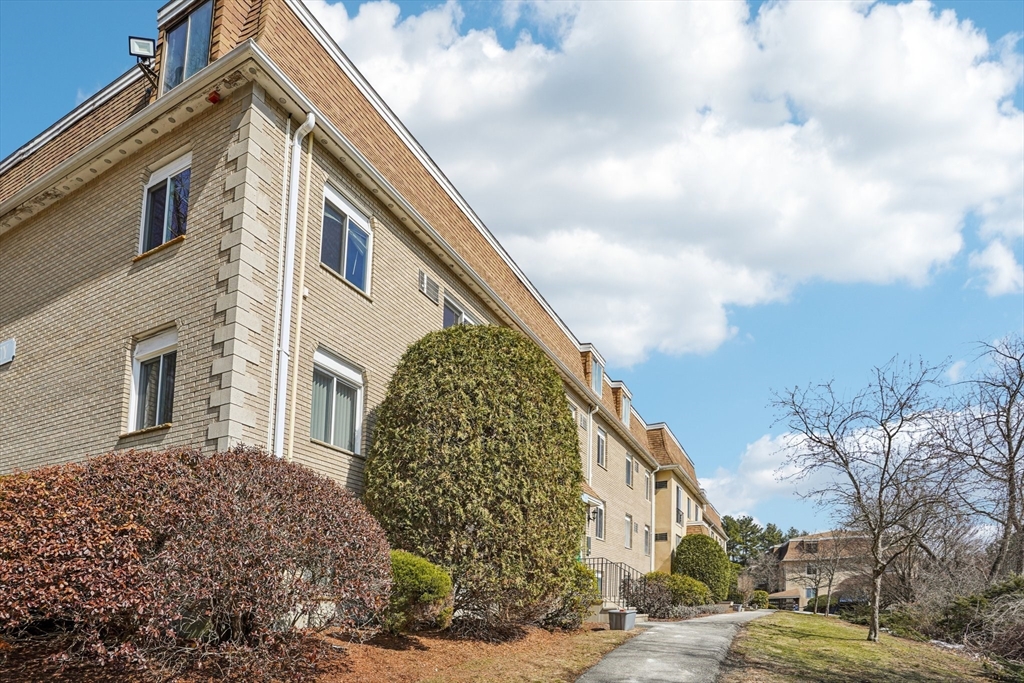 208 Swanson Road, Unit 526 Boxborough, MA 01719 - Photo 15 of 18 a view of a house with a yard