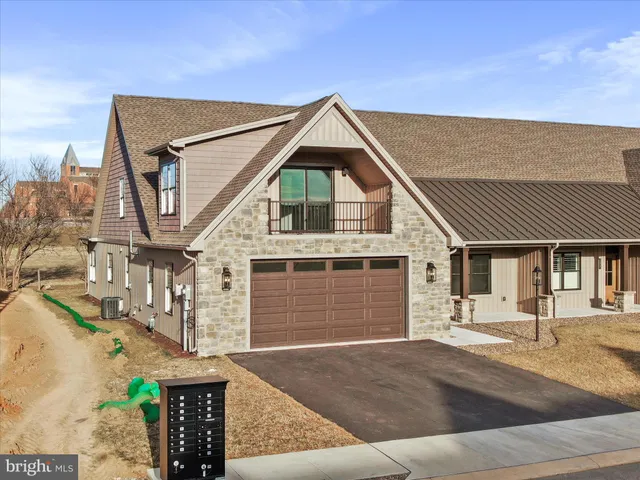 a front view of a house with a garage
