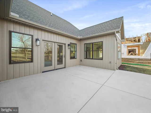 a view of a house with wooden fence
