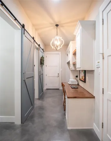 a kitchen that has a lot of cabinets in it