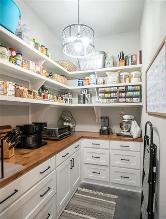 a kitchen with cabinets and window
