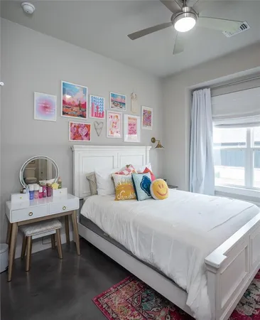 a bedroom with a bed and a table in it