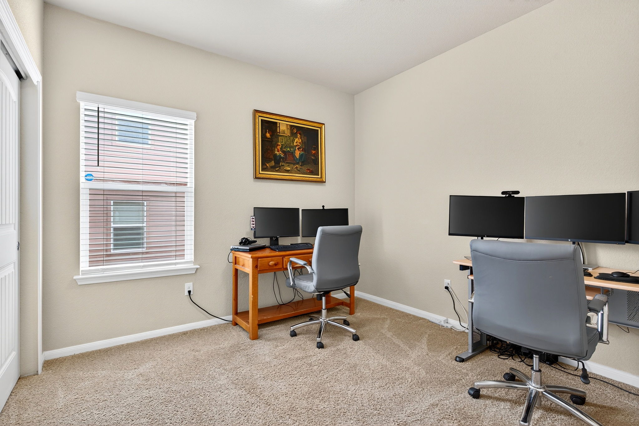 131 Coleto Creek Loop Kyle, TX 78640 - Photo 16 of 30 Versatile bedroom currently used as a dual home office — perfect for remote work or hobby space.
