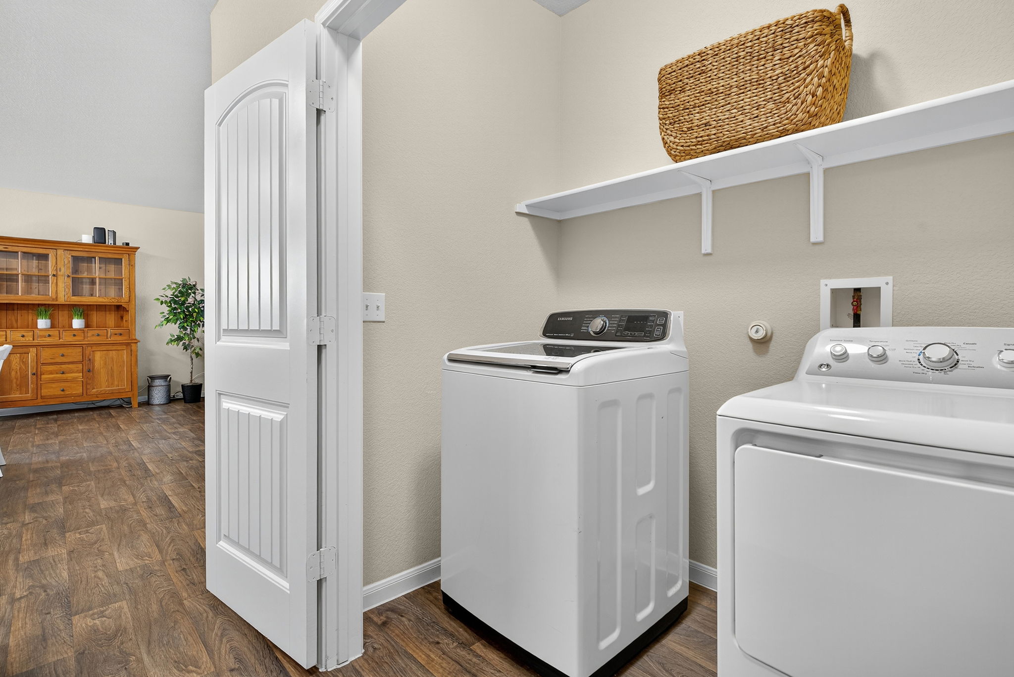 131 Coleto Creek Loop Kyle, TX 78640 - Photo 21 of 30 Dedicated laundry space with hallway access and extra shelving—washer & dryer included!