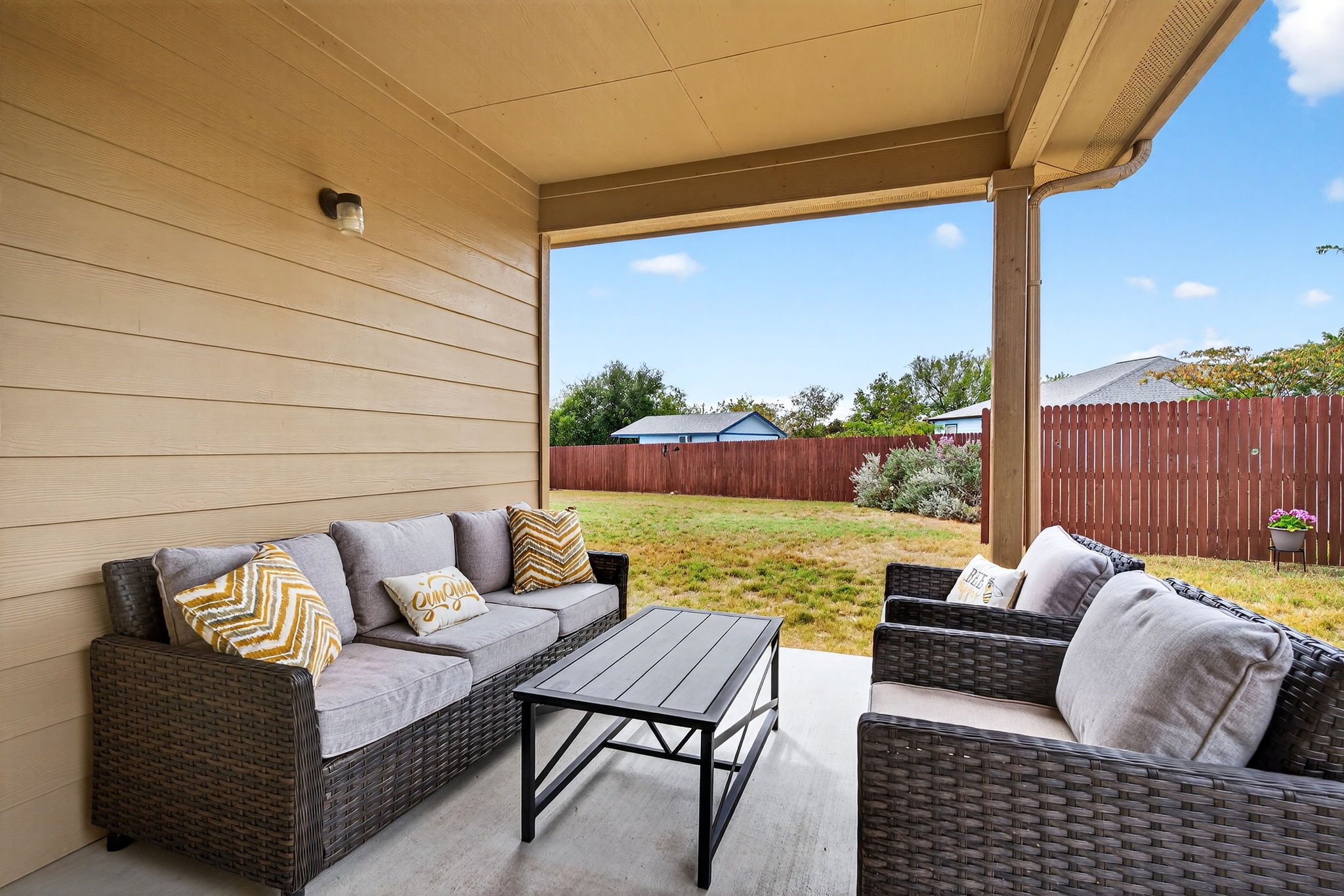 131 Coleto Creek Loop Kyle, TX 78640 - Photo 22 of 30 Covered patio with shaded lounge area — perfect for morning coffee or evening unwinding.
