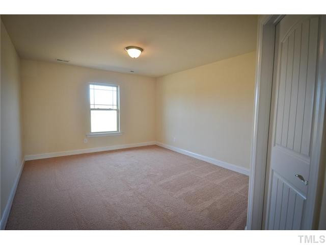 117 Weathers Street Rolesville, NC 27571 - Photo 13 of 16 Spacious secondary bedroom with large walk-in closet. Bedroom