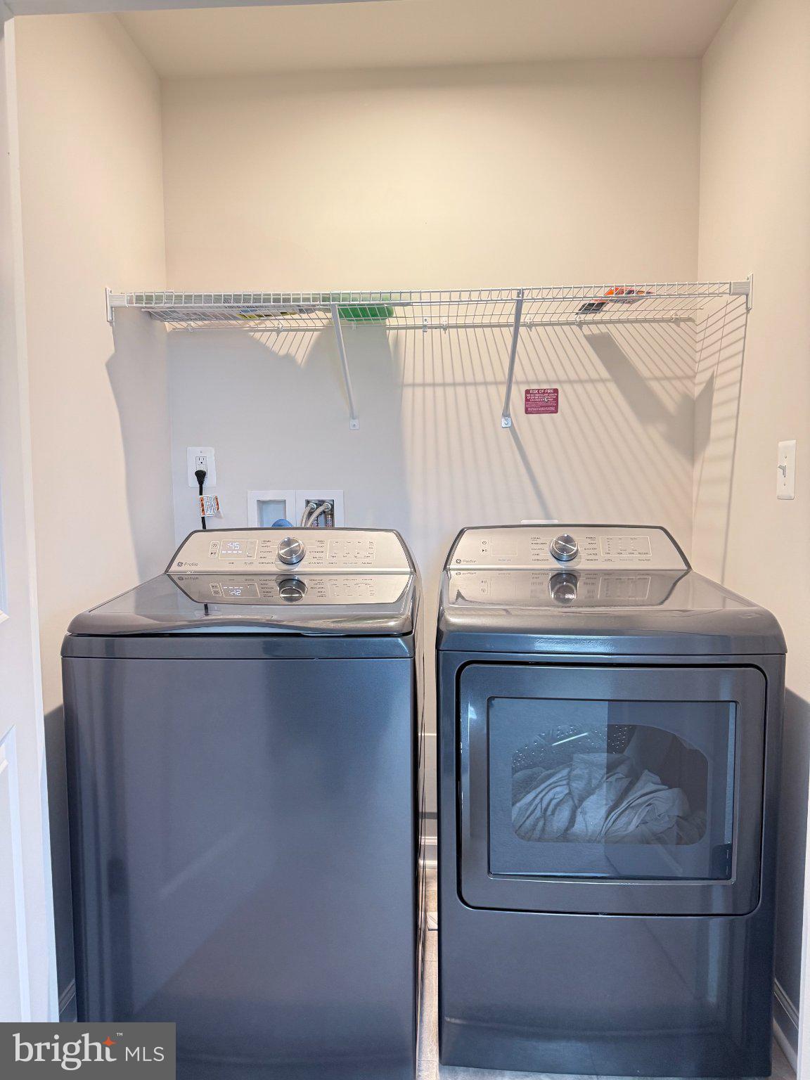 238 Coolidge Avenue Ranson, WV 25438 - Photo 11 of 17 Modern laundry space with sleek appliances.