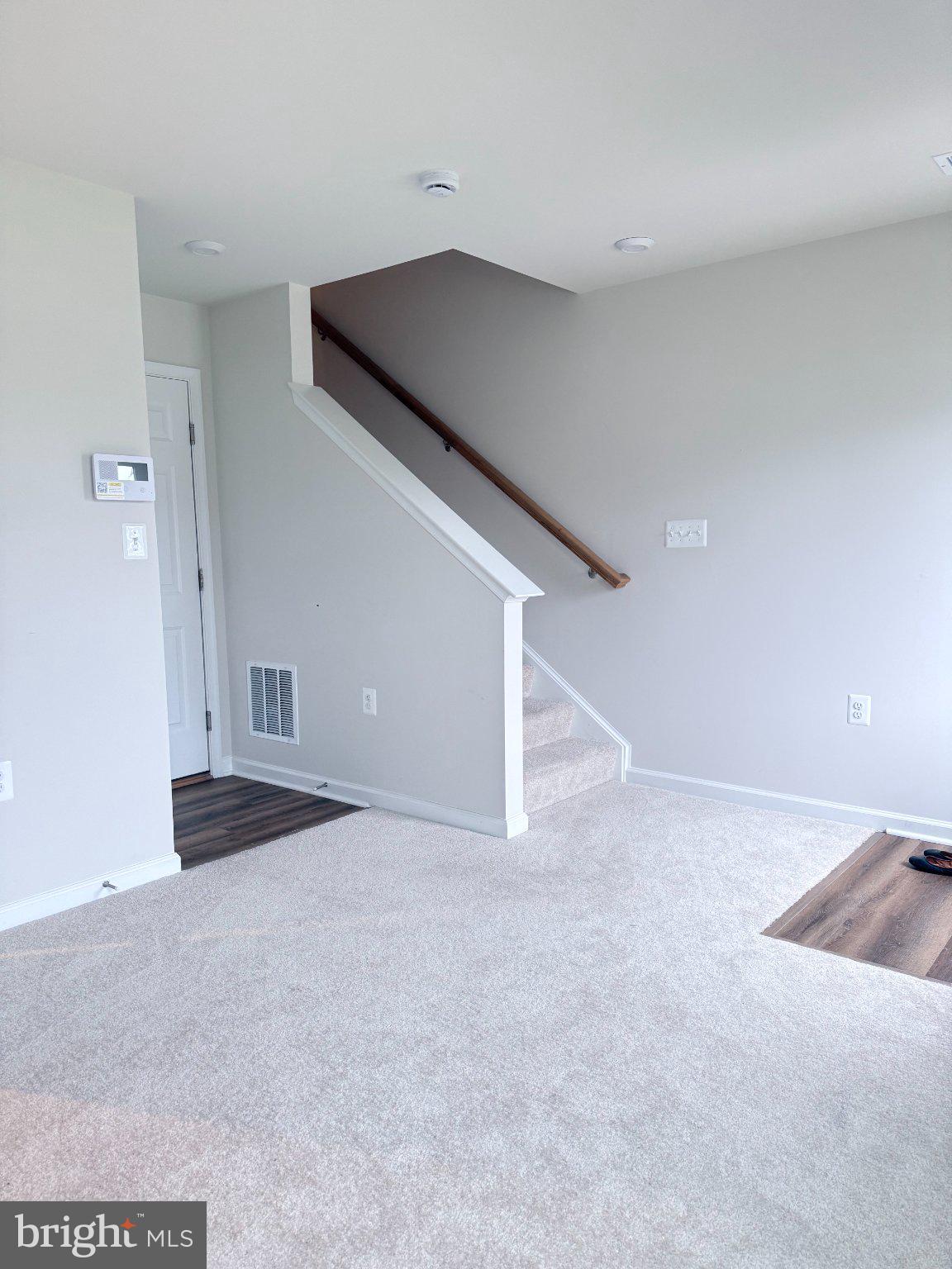238 Coolidge Avenue Ranson, WV 25438 - Photo 12 of 17 Bright and airy entryway with stairs.