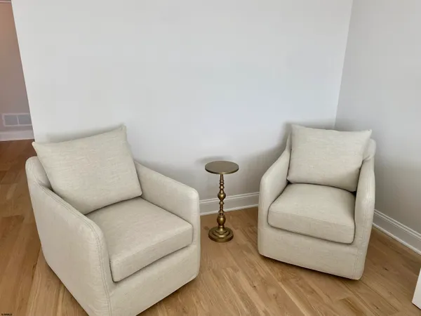 a living room with furniture and a lamp