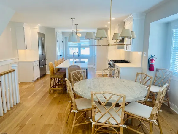 a kitchen with kitchen island a counter space a sink and a stove
