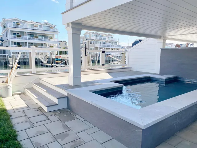 a view of swimming pool with outdoor seating
