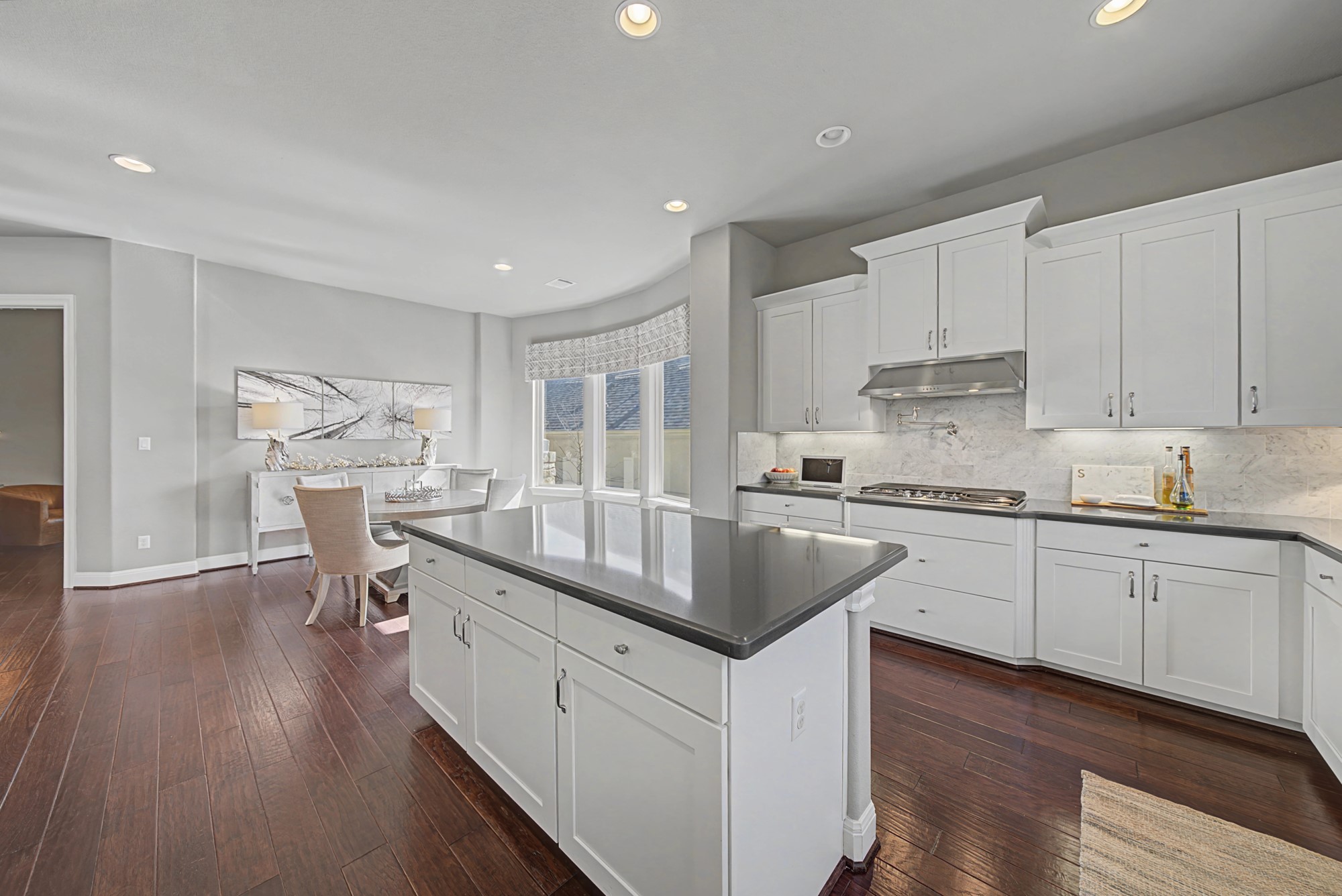 16024 La Rosa Drive Bee Cave, TX 78738 - Photo 16 of 39 This kitchen is packed with features - note the pot filler and under cabinet lighting.