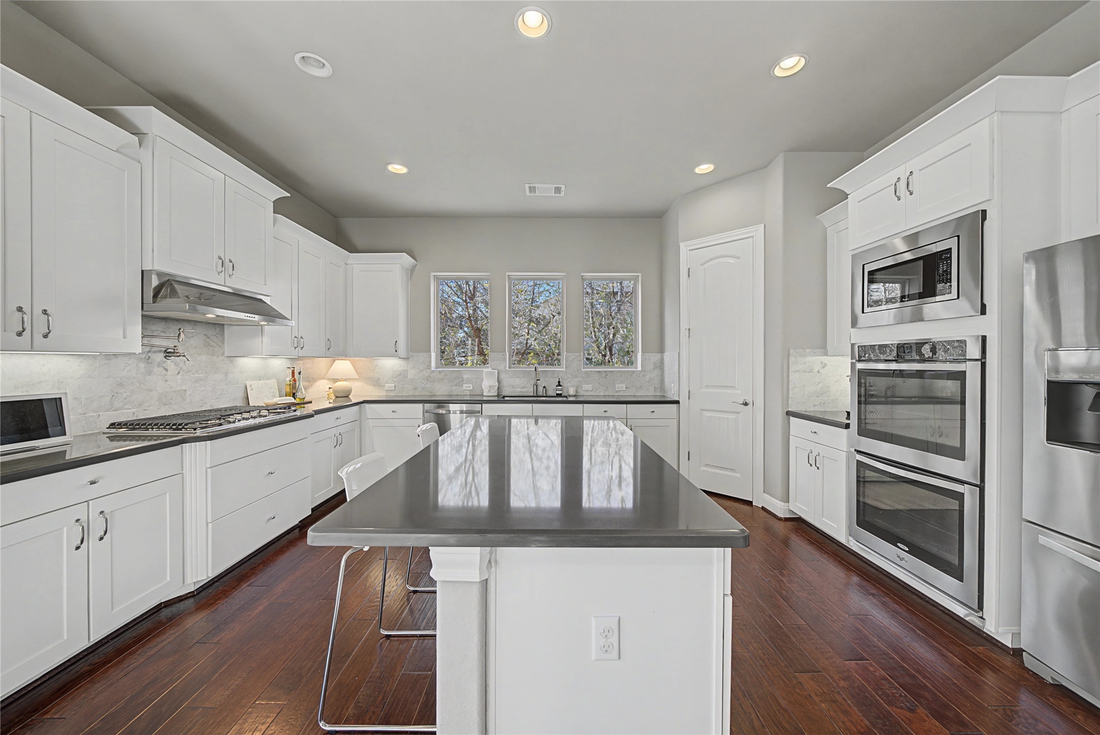 16024 La Rosa Drive Bee Cave, TX 78738 - Photo 18 of 39 So much storage and and the three large windows offer backyard views.