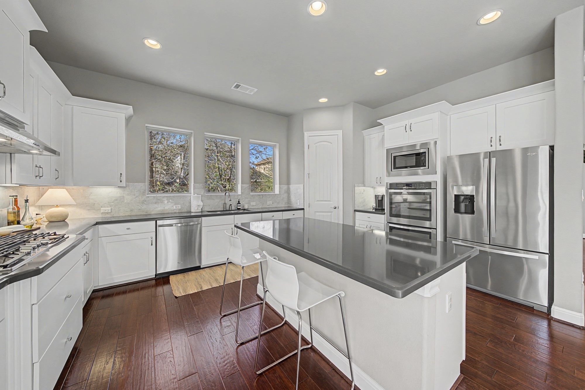 16024 La Rosa Drive Bee Cave, TX 78738 - Photo 19 of 39 The large center island has space for snackers!