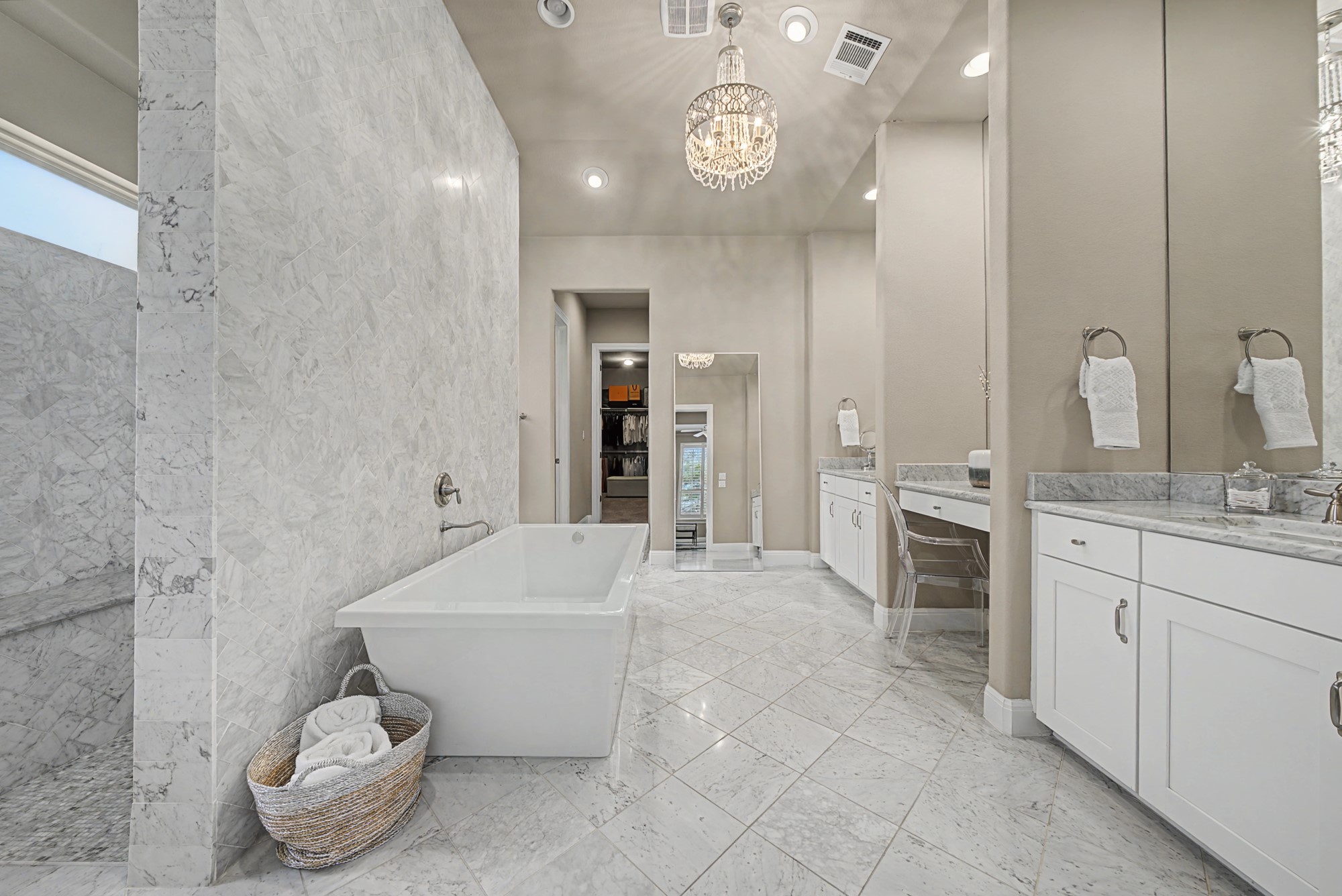 16024 La Rosa Drive Bee Cave, TX 78738 - Photo 25 of 39 Marble flooring, a statement herringbone tile wall, and oversized soaking tub.