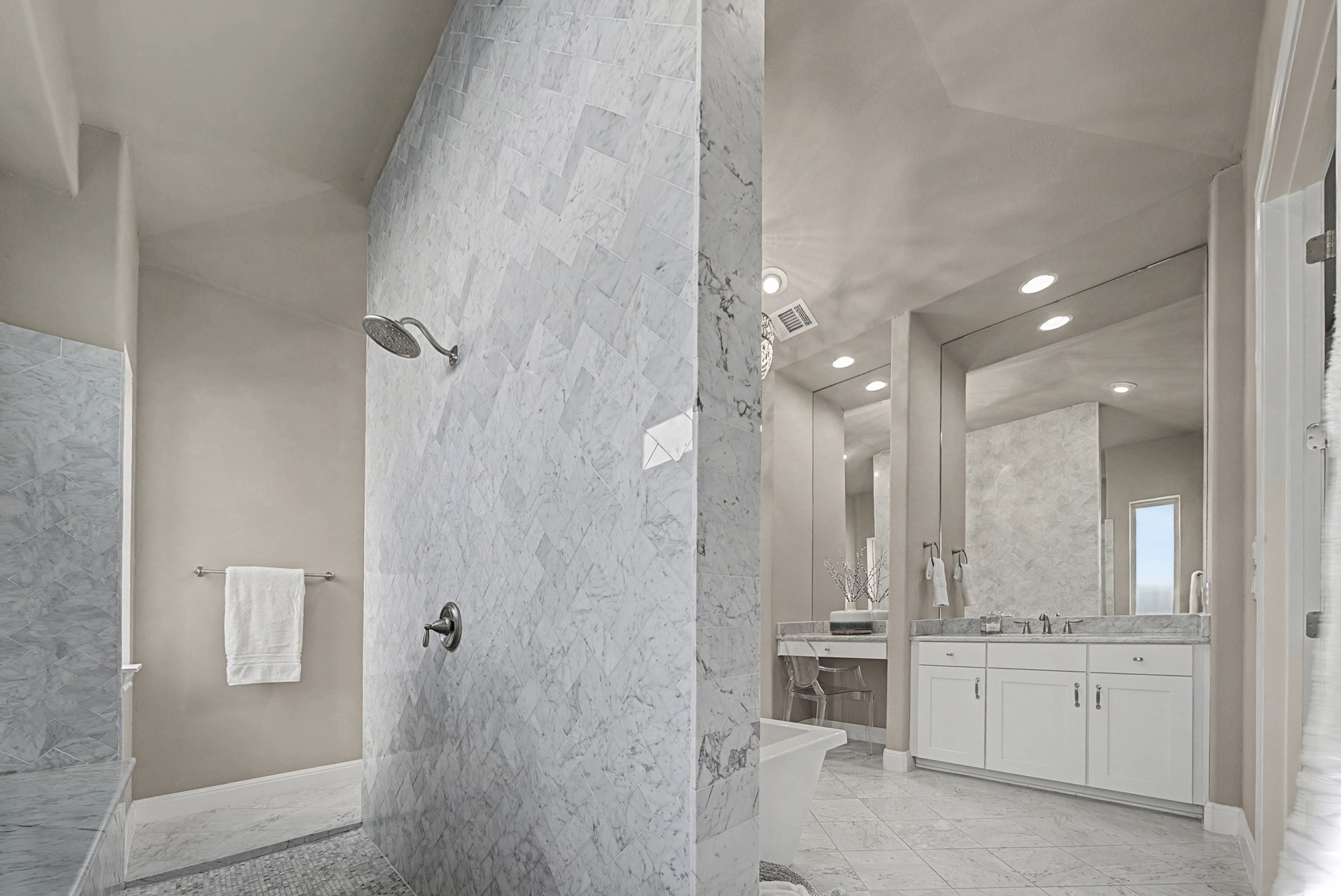 16024 La Rosa Drive Bee Cave, TX 78738 - Photo 26 of 39 HUGE double entry shower with mosaic tile flooring, full length bench and frosted transom window.