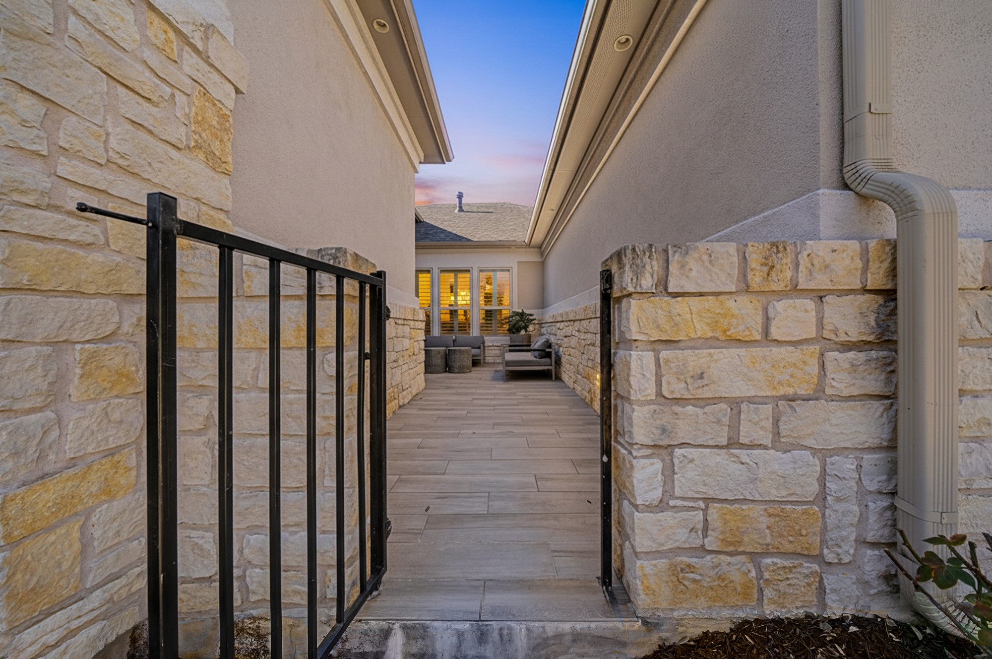 16024 La Rosa Drive Bee Cave, TX 78738 - Photo 4 of 39 Front gate opens to tiled courtyard.