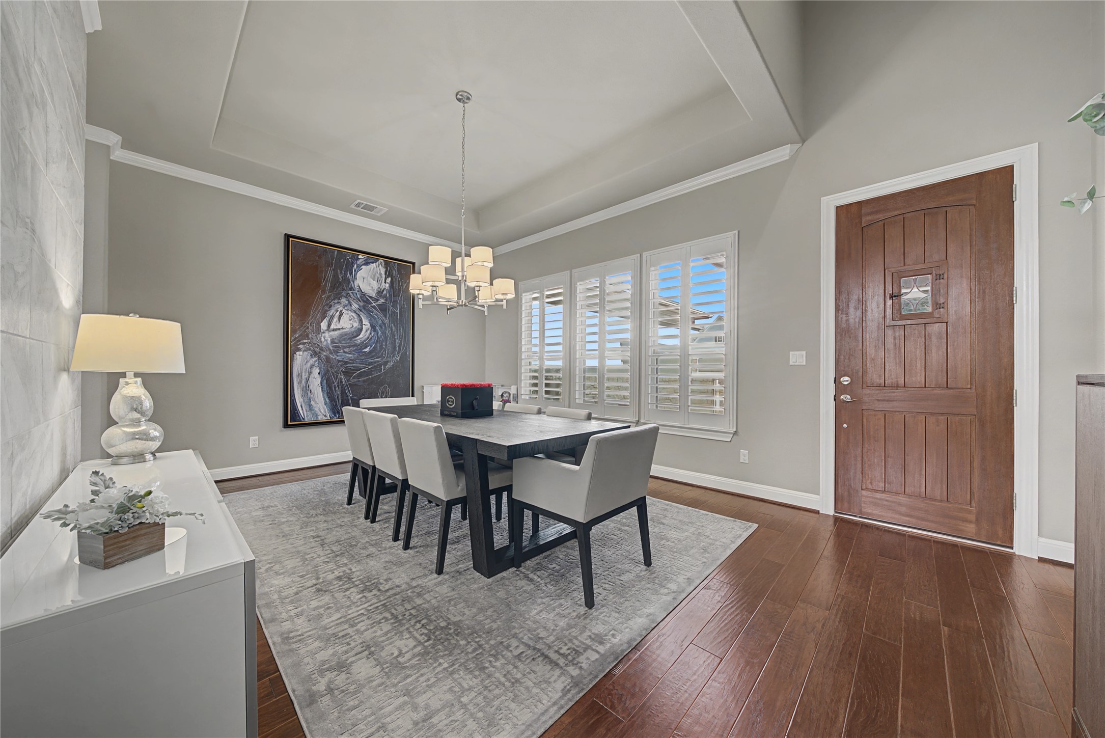 16024 La Rosa Drive Bee Cave, TX 78738 - Photo 7 of 39 Stunning entry featuring the spacious dining room with tray ceiling.