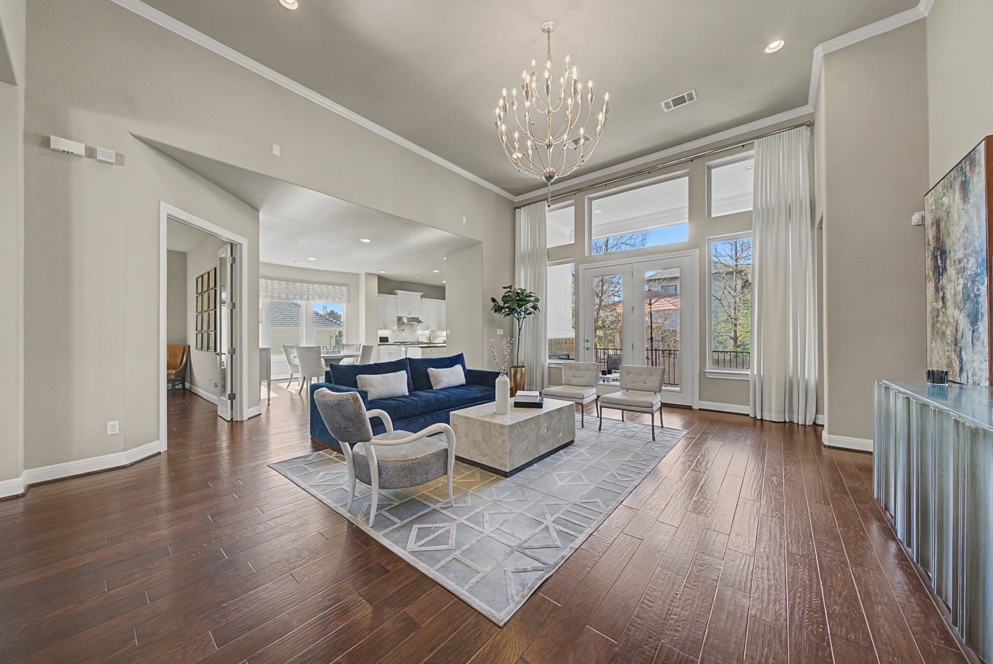 16024 La Rosa Drive Bee Cave, TX 78738 - Photo 10 of 39 The wall of windows and double doors make this room shine.