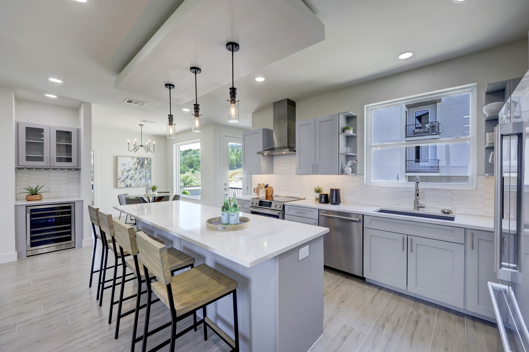 4300 Mansfield Dam Road, Unit 1221 Austin, TX 78734 - Photo 9 of 38 a kitchen with stainless steel appliances kitchen island granite countertop a sink and cabinets