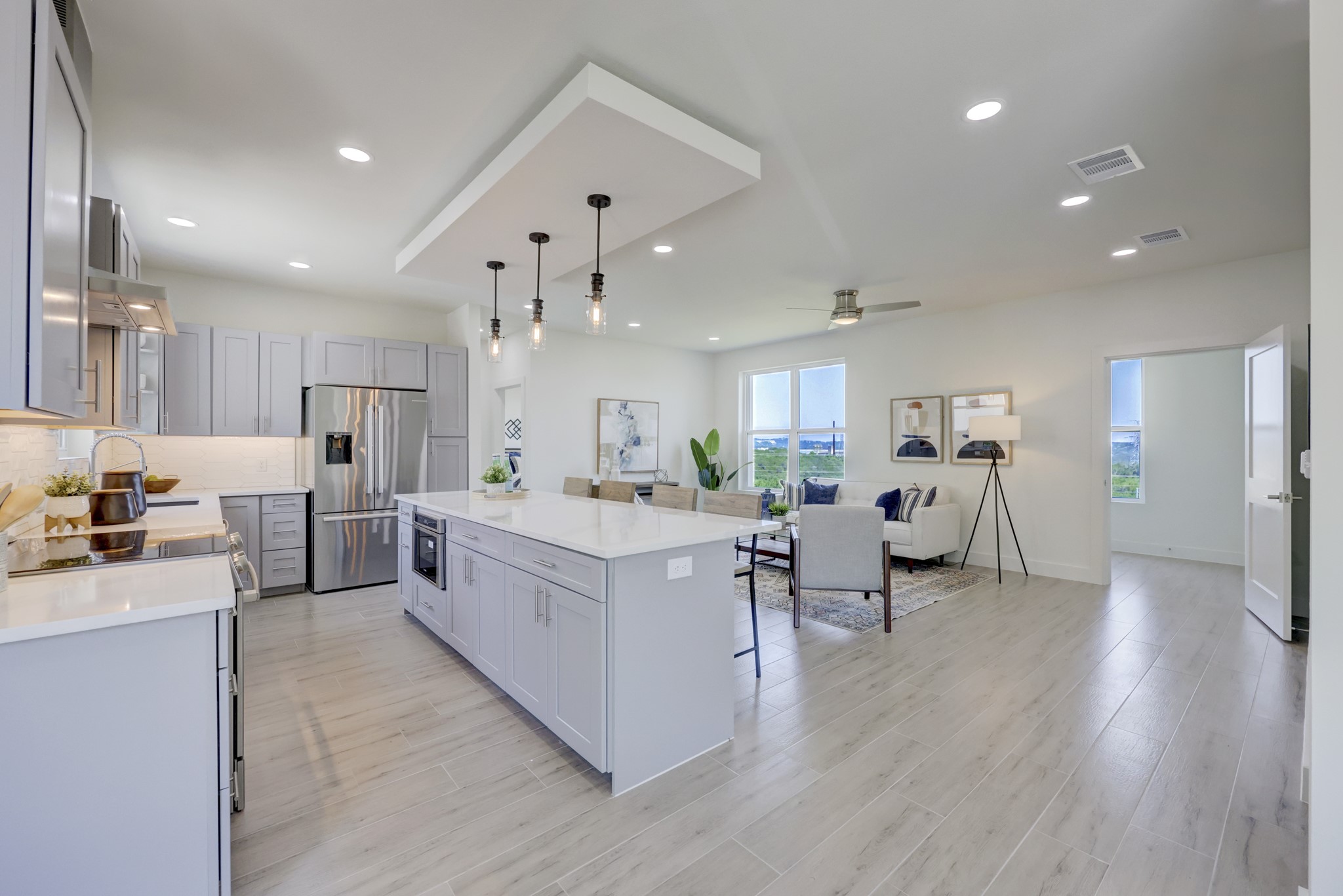 4300 Mansfield Dam Road, Unit 1221 Austin, TX 78734 - Photo 33 of 38 a large white kitchen with lots of counter space wooden floor and appliances