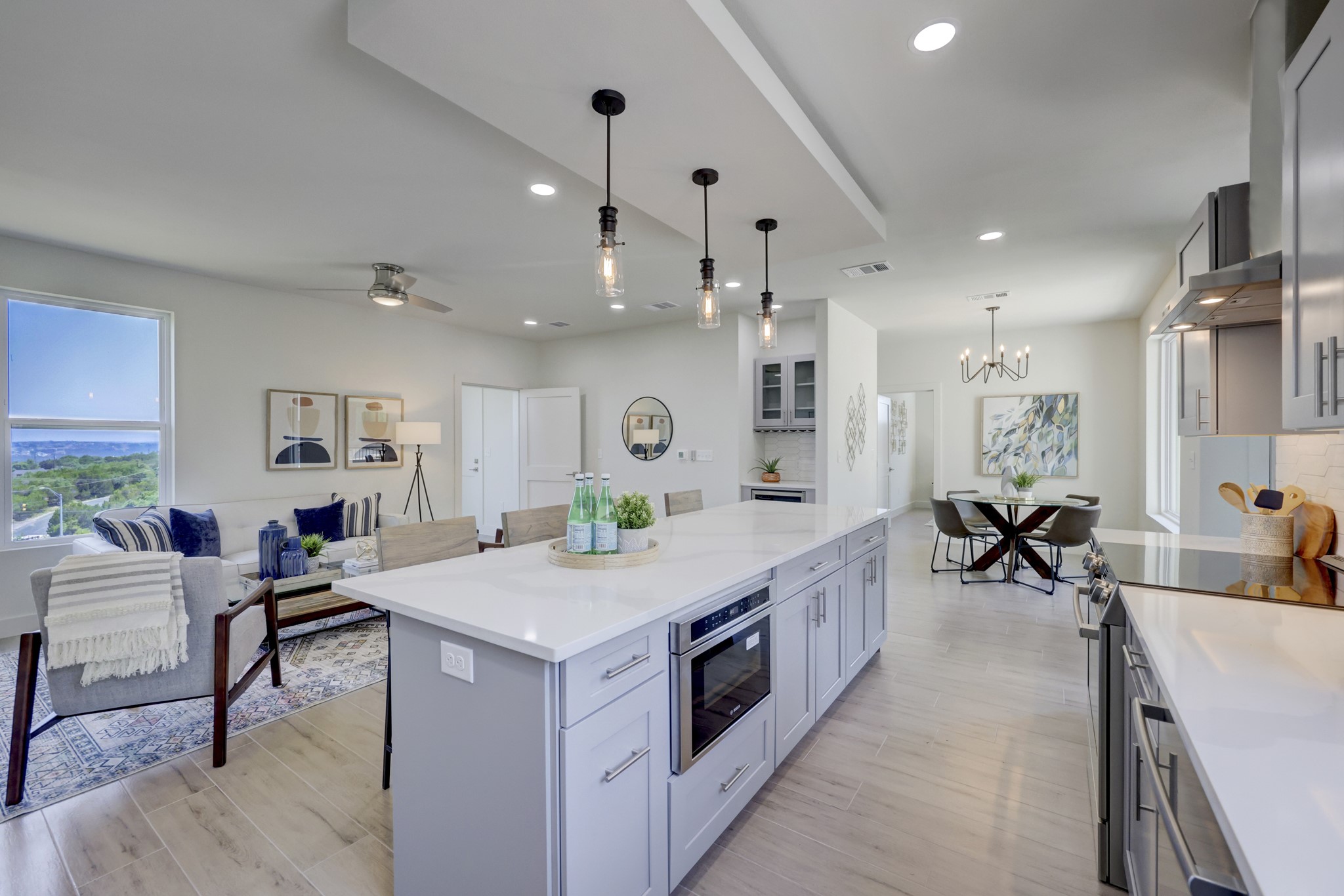 4300 Mansfield Dam Road, Unit 1221 Austin, TX 78734 - Photo 34 of 38 a kitchen that has a lot of cabinets a sink and a wooden floor in it