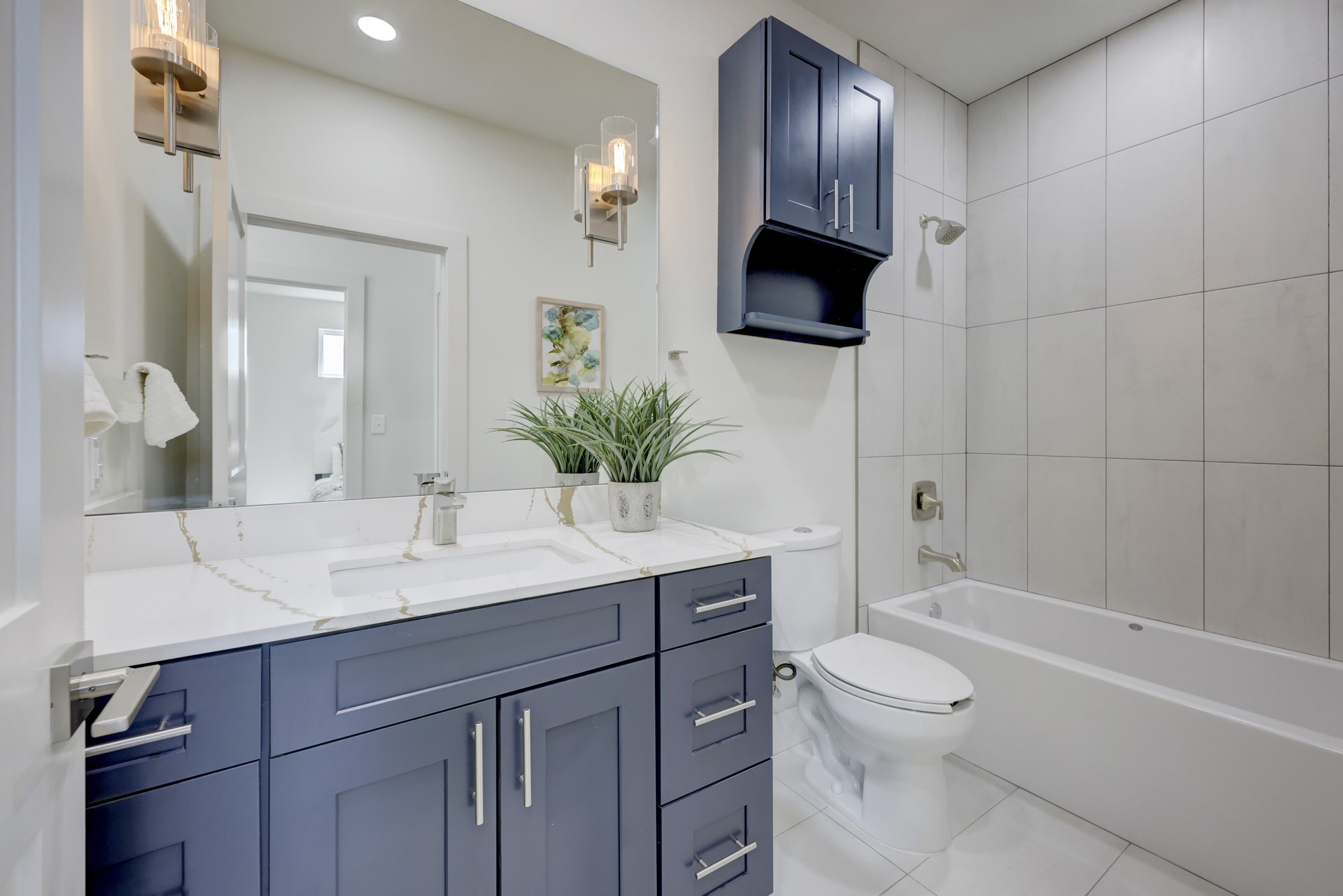 4300 Mansfield Dam Road, Unit 1221 Austin, TX 78734 - Photo 12 of 38 a bathroom with a granite countertop sink a toilet and bathtub